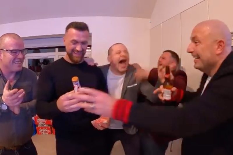 A small group reacting to a private close-up performance