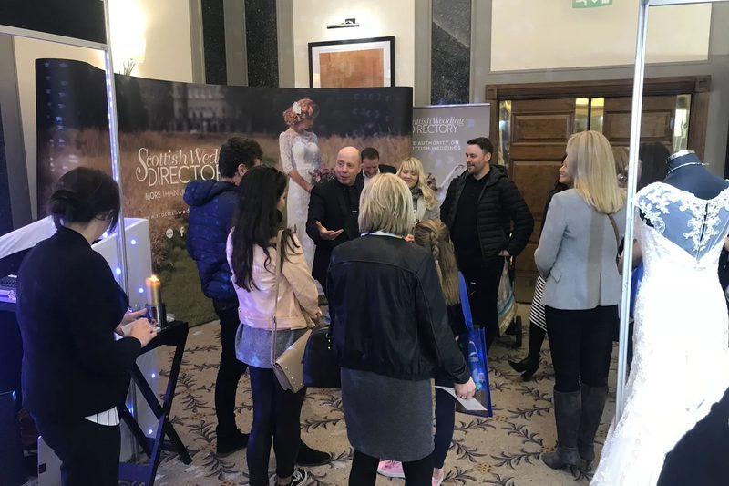 Mark drawing a crowd to an exhibition stand at a trade show
